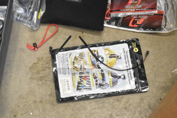 Lot of various items including Porta Brace fasteners, poly bins, cable ties, and a Wrap-It storage kit, all in good condition.
