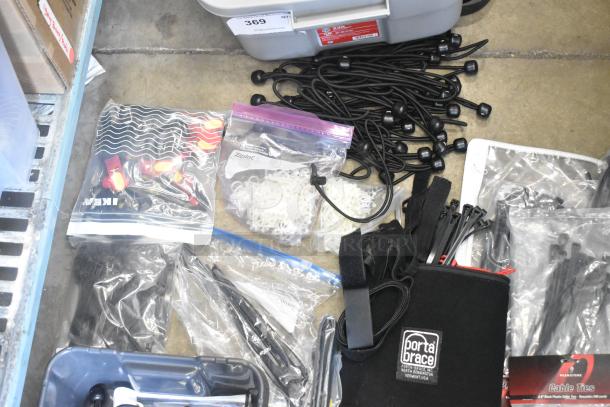 Lot of miscellaneous items including Porta Brace fasteners, various cable ties, and poly bins. Items are in mixed condition.
