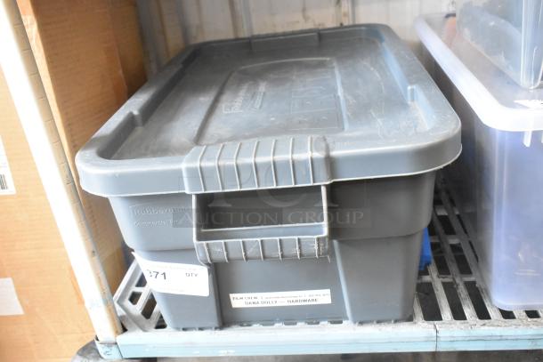 Rubbermaid poly bin with assorted hardware items. Labels read "Film Crew | Dana Dolly — Hardware." Slightly worn condition.