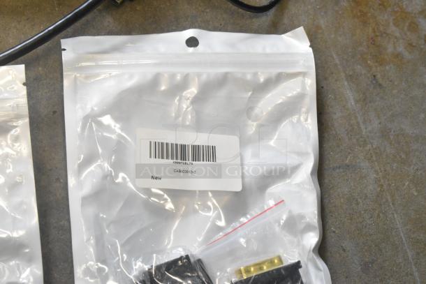 Poly bag of assorted cables with barcode label showing "CAB02201x2" and "New." Excellent condition in plastic.