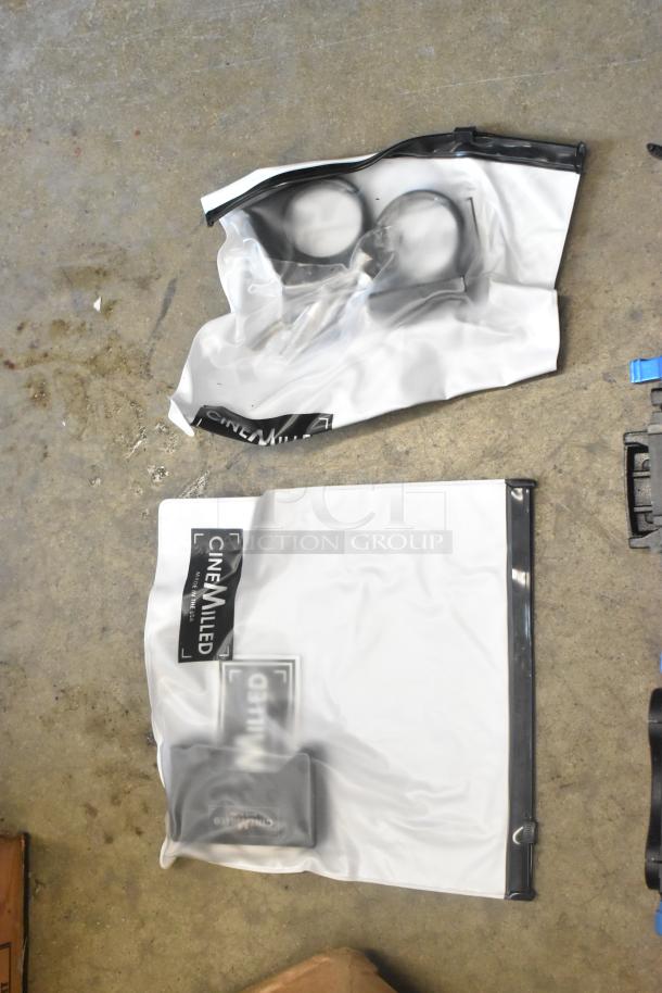 Lot of camera attachment gear in poly bin, includes CineMilled labeled bags, various parts visible, good condition.