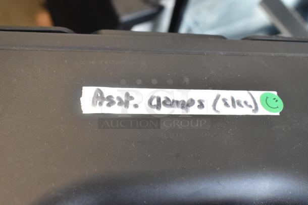 Lot of clamps in a poly bucket with a visible label reading "Asst. Clamps (Elec)" and a green smiley face sticker.