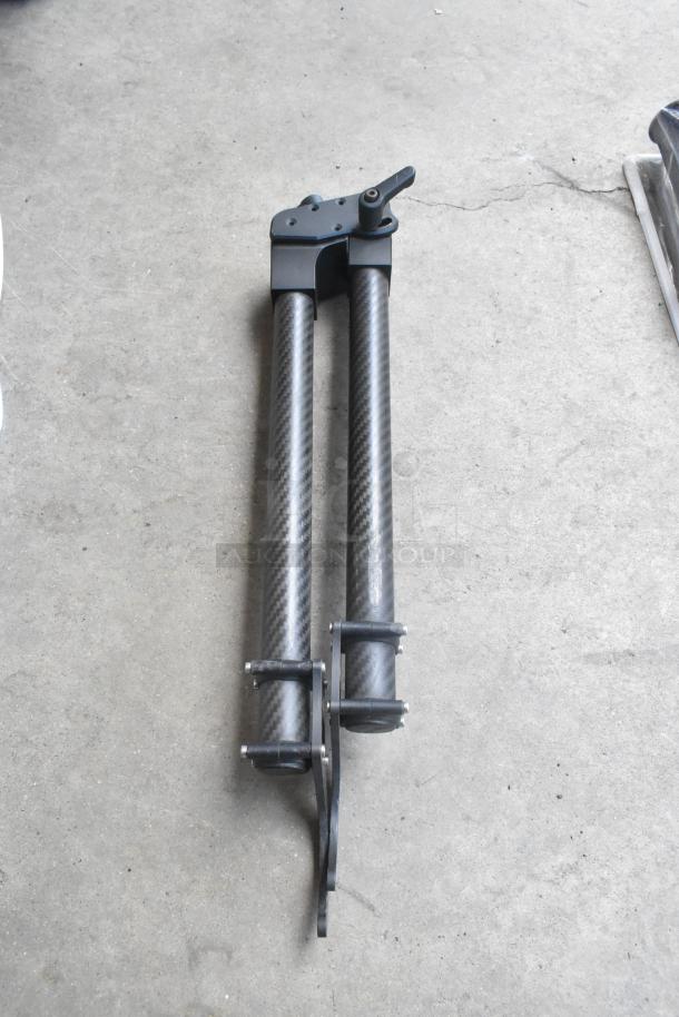 Adjustable dual-arm carbon fiber handles for Movi stabilizer; sturdy design, excellent condition, no visible damage.