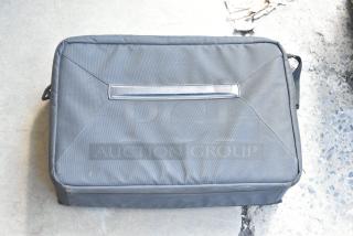 Petrol Bags black bag, rectangular shape, sturdy fabric, visible handle, slight wear; ideal for equipment storage.