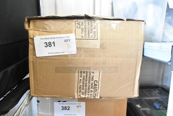 Brown box containing Kessler Riser. Auction tag 381 visible. Box appears sealed with caution tape.