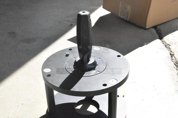 Kessler Riser, black metal, with textured handle, circular base, and visible mounting holes, in good condition.