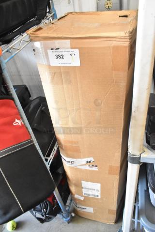 Cardboard box containing Matthews Stands with visible auction label "382 QTY." Box appears slightly worn, indicating used condition.