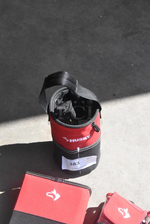 Red and black Husky tool bags with handles, shown in good condition. White label reads "383 x4," indicating auction quantity.