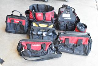 Seven assorted tool bags, mainly Husky brand, in red and black. Various styles and sizes, all in good condition.