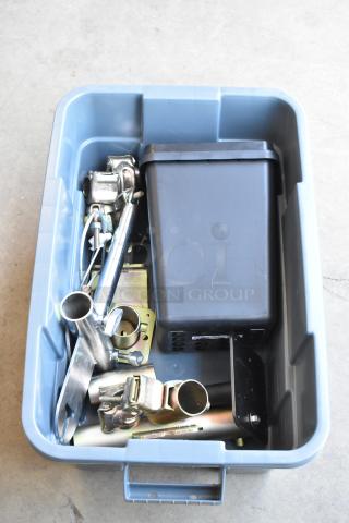 Poly bin containing various items, including speed rail clamps. Items are in good condition, suitable for versatile use.