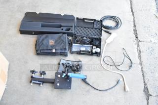 Lot of various audio accessories and knobs in poly bin, includes cables, microphone, and Porta-Brace bag, good condition.