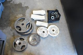 Lot of various items including Sports Authority weight plates, clamps, and a poly bin. Plates marked 10 lb and 2.5 lb.