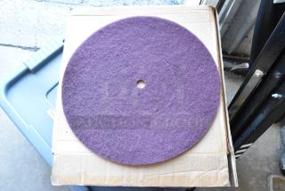 Box of 10 Norton Bear-Tex floor pads, new condition, purple fiber, round shape with central hole, on cardboard box.