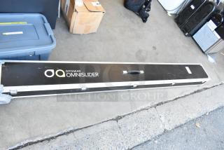 Ditogear Omnislider in hard case, shows brand logo, black case with handle, appears in good condition on warehouse floor.