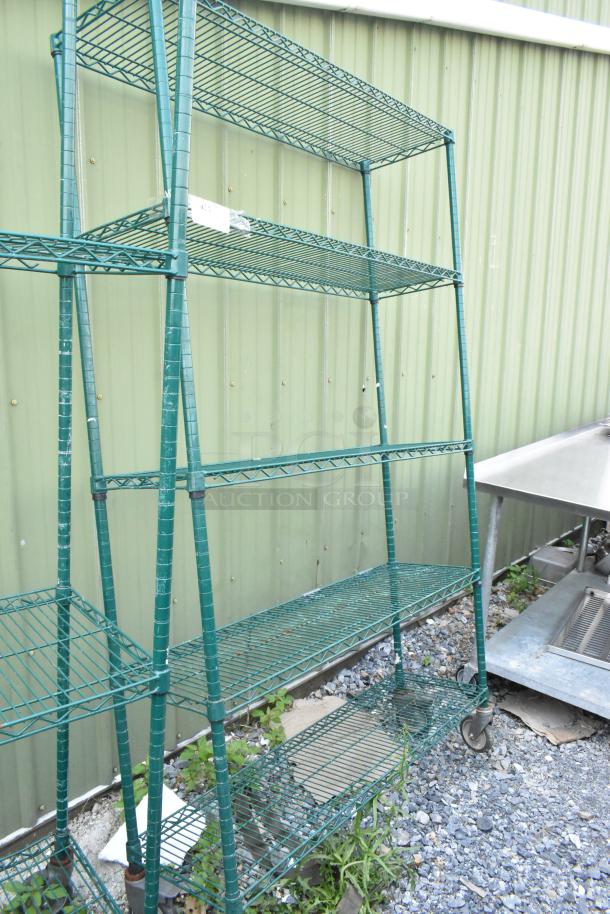Green 5-tier wire shelving unit with commercial casters. Needs dismantling. Consider freight charges.