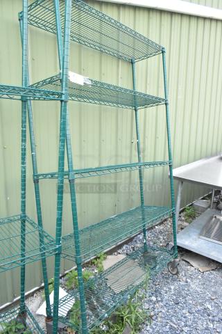 Green 5-tier wire shelving unit with commercial casters. Needs dismantling. Consider freight charges.