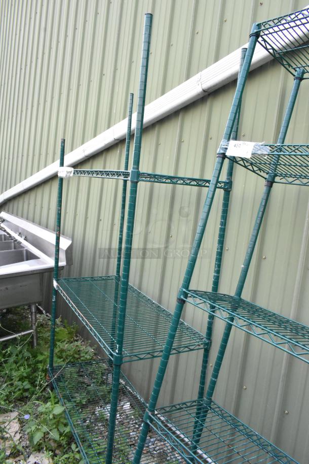 Green 3-tier wire shelving unit on commercial casters, metal construction, tag showing dimensions. Buyer must dismantle.