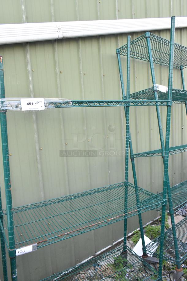 Green 3-tier wire shelving unit on commercial casters, auction tag visible, sturdy construction, for dismantling.
