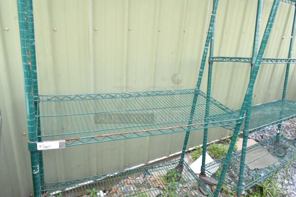 Green 3-tier wire shelving unit on commercial casters, slightly rusted. Label reads "Finger." Buyer must dismantle.
