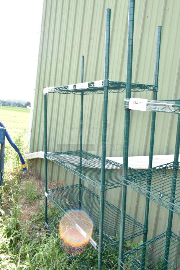 Green 4-tier wire shelving unit on commercial casters. Buyer must dismantle. Consider freight charges.