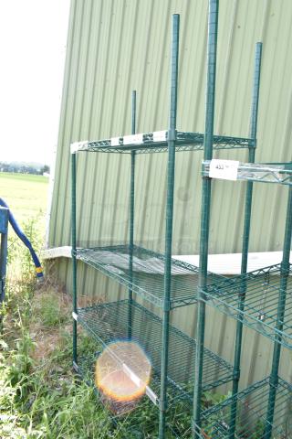 Green 4-tier wire shelving unit on commercial casters. Buyer must dismantle. Consider freight charges.