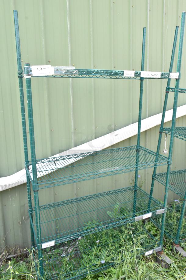 Green 4-tier wire shelving unit on commercial casters, in good condition. Includes labels for organization. Buyer to dismantle.