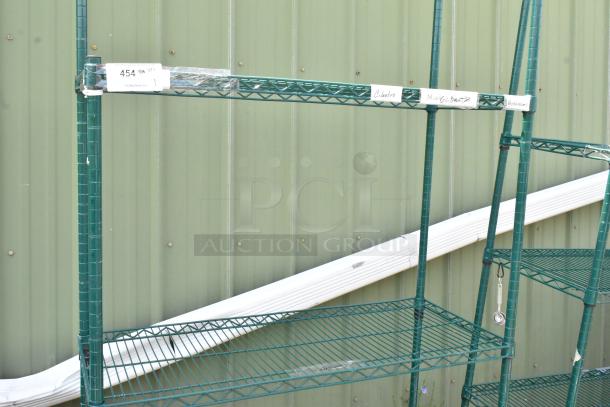 Green 4-tier wire shelving unit on commercial casters, sturdy condition, visible labels; buyer must dismantle.