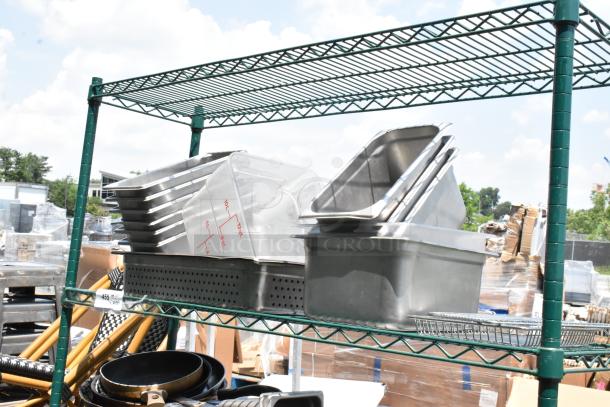 Green 4-tier wire shelving unit on casters with stainless steel and poly bins. Includes measurement markings. Buyer dismantles.