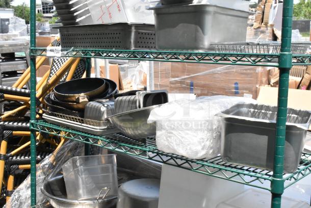 Green 4-tier wire shelving unit on casters, includes stainless steel and poly bins. Buyer must dismantle.