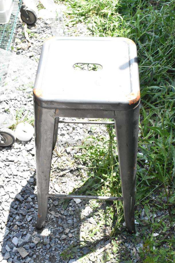 Metal Tolix style stool, industrial design, slightly worn edges, suitable for indoor or outdoor use. 8 available.