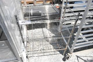 Chrome finish 3-tier wire shelving unit, used, on casters. Buyer must dismantle. Includes auction label "479."