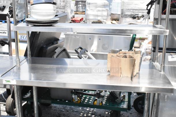 Regency stainless steel table with two-tier over shelf and under shelf, used, sturdy, visible logo label on edge.