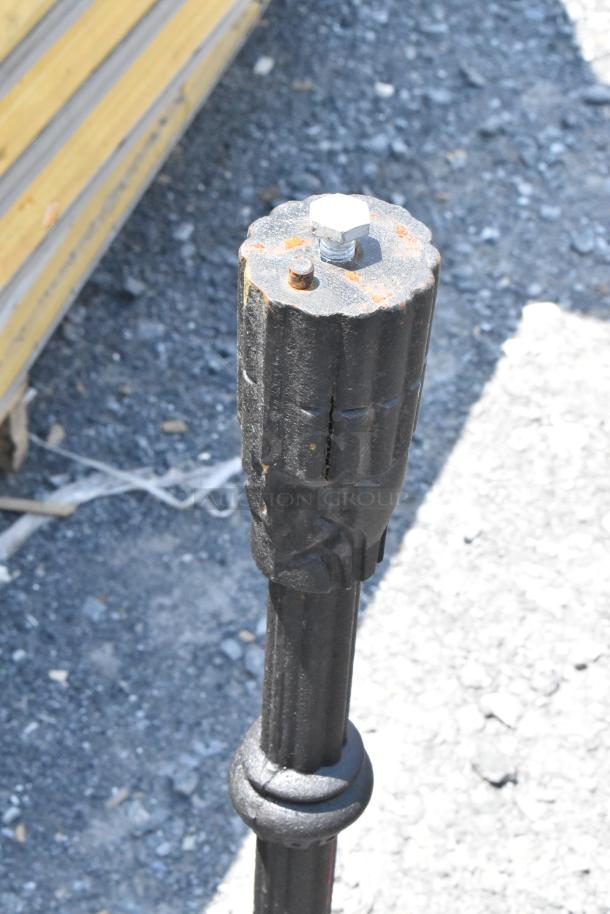 Metal table base with visible rust, sturdy design for support, sold with six additional bases and one tabletop.