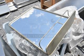 Rectangular mirror with metal frame and shelf, reflecting blue sky. Slight wear visible; packaged with bubble wrap.