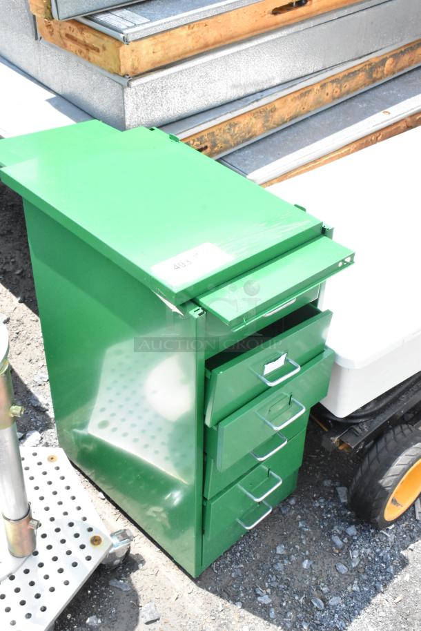 Green metal filing cabinet with multiple drawers, minor wear visible. Marked with sticker "493". Suitable for office use.