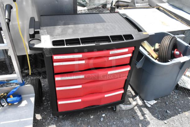 Black and red poly cart on commercial casters, featuring labeled storage drawers for organization; used condition.