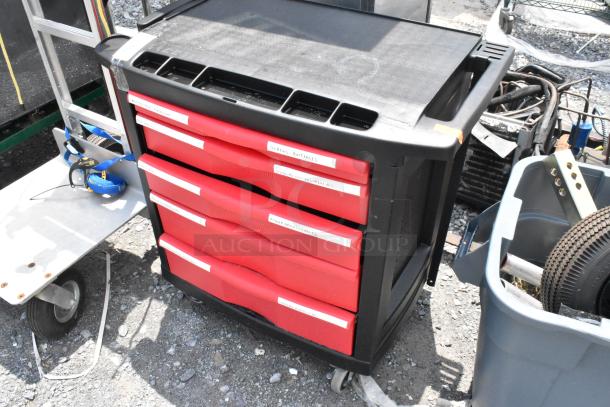 Black and red poly cart on commercial casters with labeled red drawers, sturdy design, used condition.