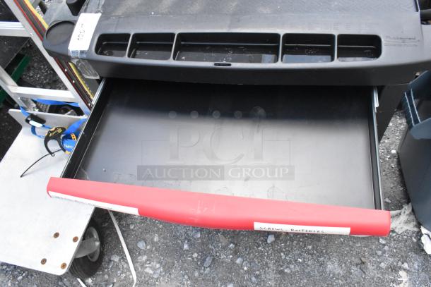 Black and red poly cart on commercial casters, featuring compartments and a drawer labeled "Screws Batteries," by Rubbermaid.