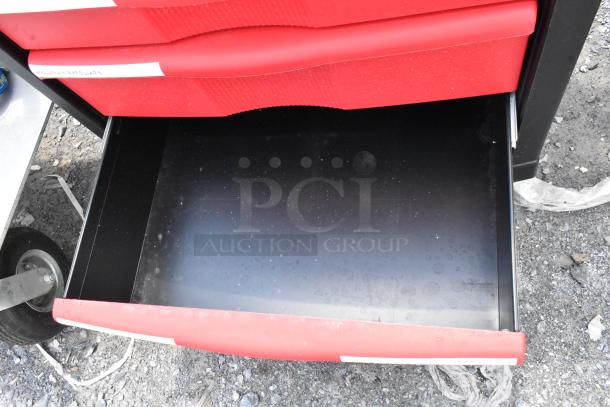 Black and red poly cart with open drawer, showing commercial casters. Sturdy design, ideal for heavy-duty use.