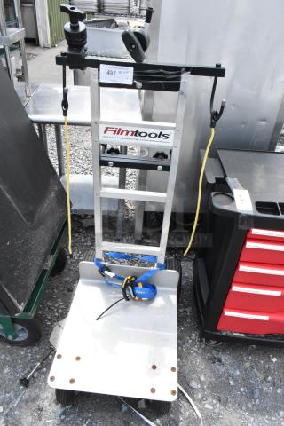 Filmtools metal furniture dolly, aluminum frame, logo label, sturdy wheels, excellent condition, with straps and clamp attachments.