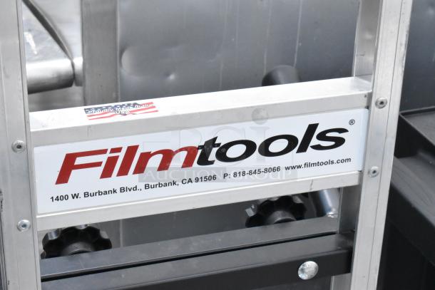 Filmtools Metal Furniture Dolly with logo and USA-made sticker. Location and contact details visible. Durable metal frame.