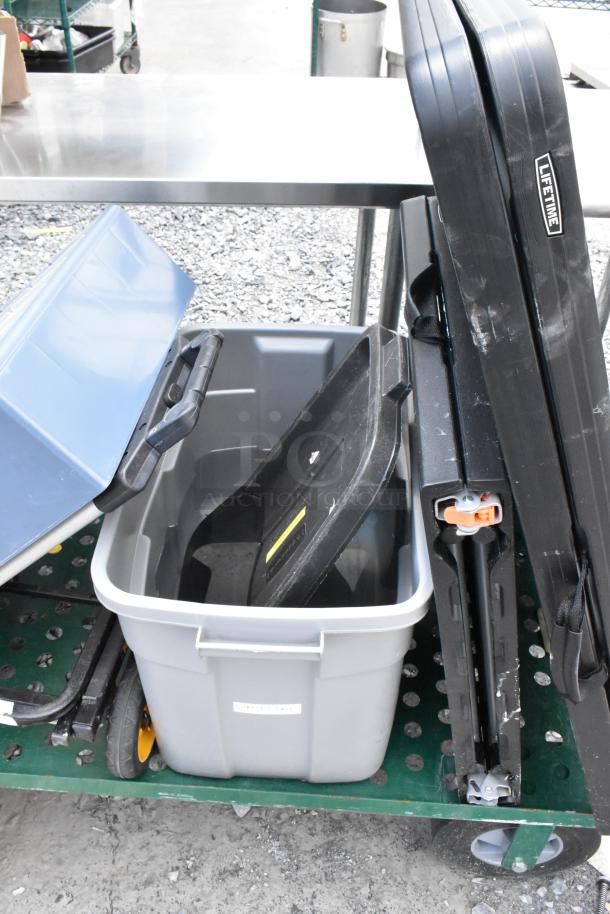 Green metal flat cart with folding table, poly bin; features LifeTime label, wheels, and visible wear.