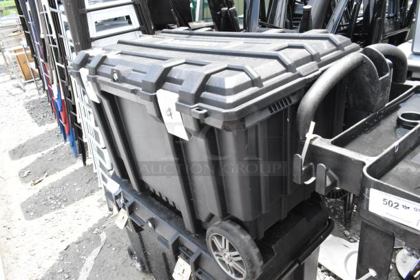 Husky black poly case on casters, rugged design, secure latches, visible label, ideal for storage and transport.