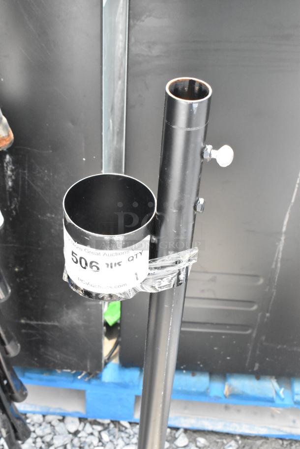 Black metal stand with adjustable height, sturdy construction. Attached label with auction details. Good condition.