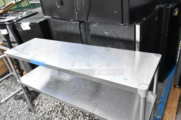Stainless steel 2-tier over shelf, in good condition, with sturdy construction and polished finish.