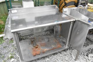 Stainless Steel Table w/ Under Shelf and Back Splash. - Item #1194452