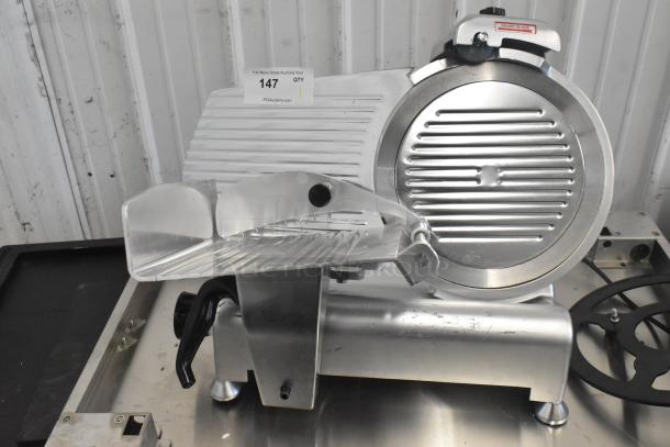 Avantco 177SL312 metal meat slicer with blade sharpener, 115V, showing power cord and sharp blade caution label.