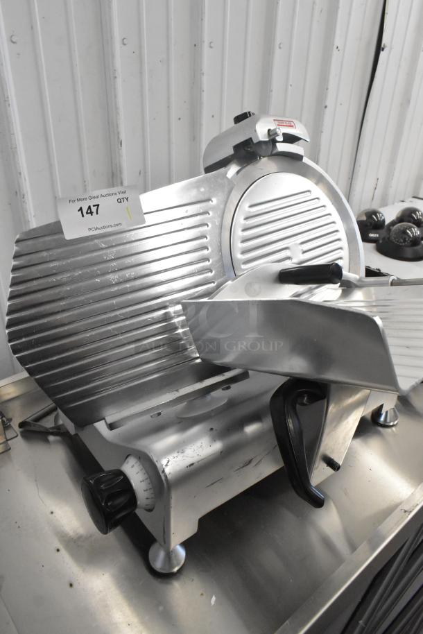 Avantco 177SL312 metal commercial meat slicer with built-in blade sharpener, 115V, 1 phase. Used condition with visible wear.