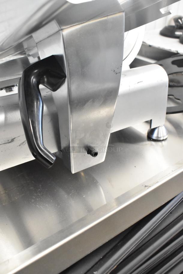 Avantco 177SL312 commercial meat slicer, stainless steel with blade sharpener, black handle, 115V, in good condition.