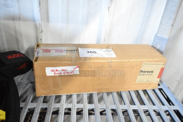 Cardboard box labeled "Velbo Mini Stand w/ Head," with a product tag and SKU number 366. Box condition is good.